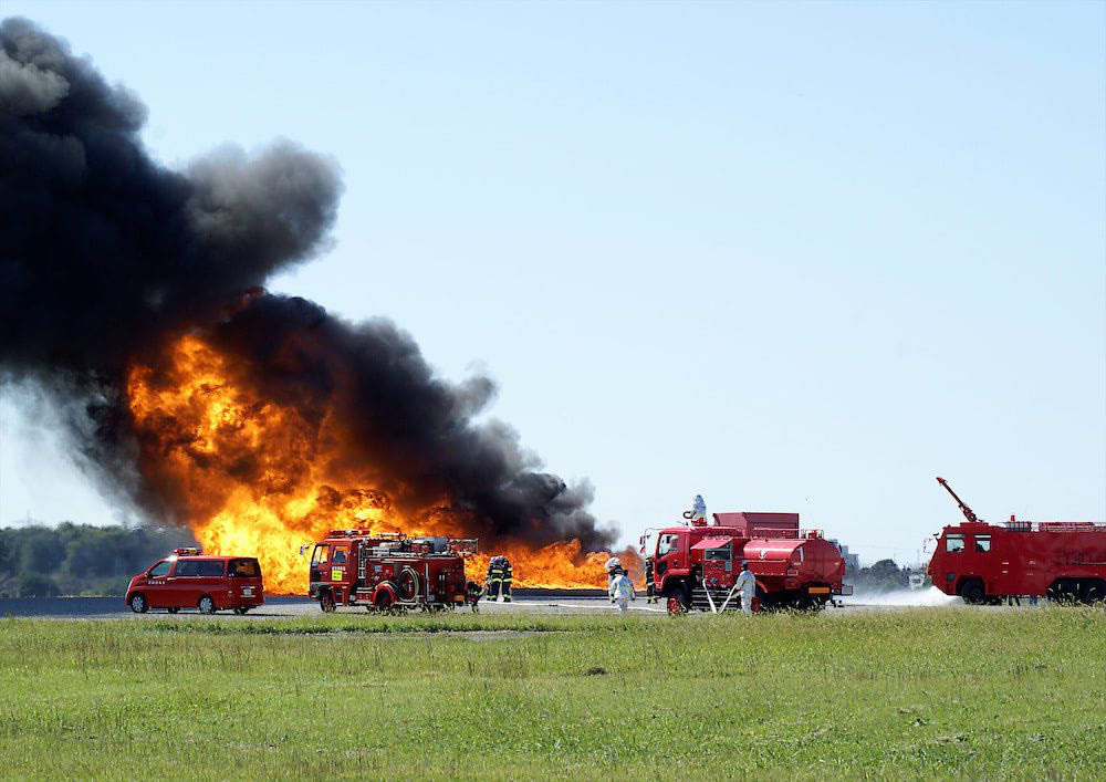 oil fire and fire trucks